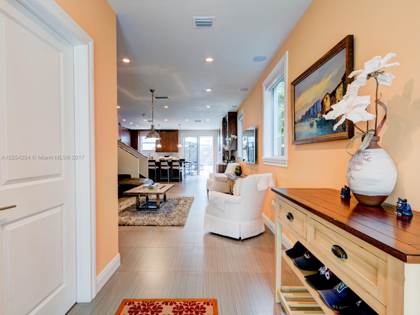 2993 Ruth Street, Unit 2993 Coconut Grove, FL 33133 - Photo 3 of 29 a living room with furniture and a table