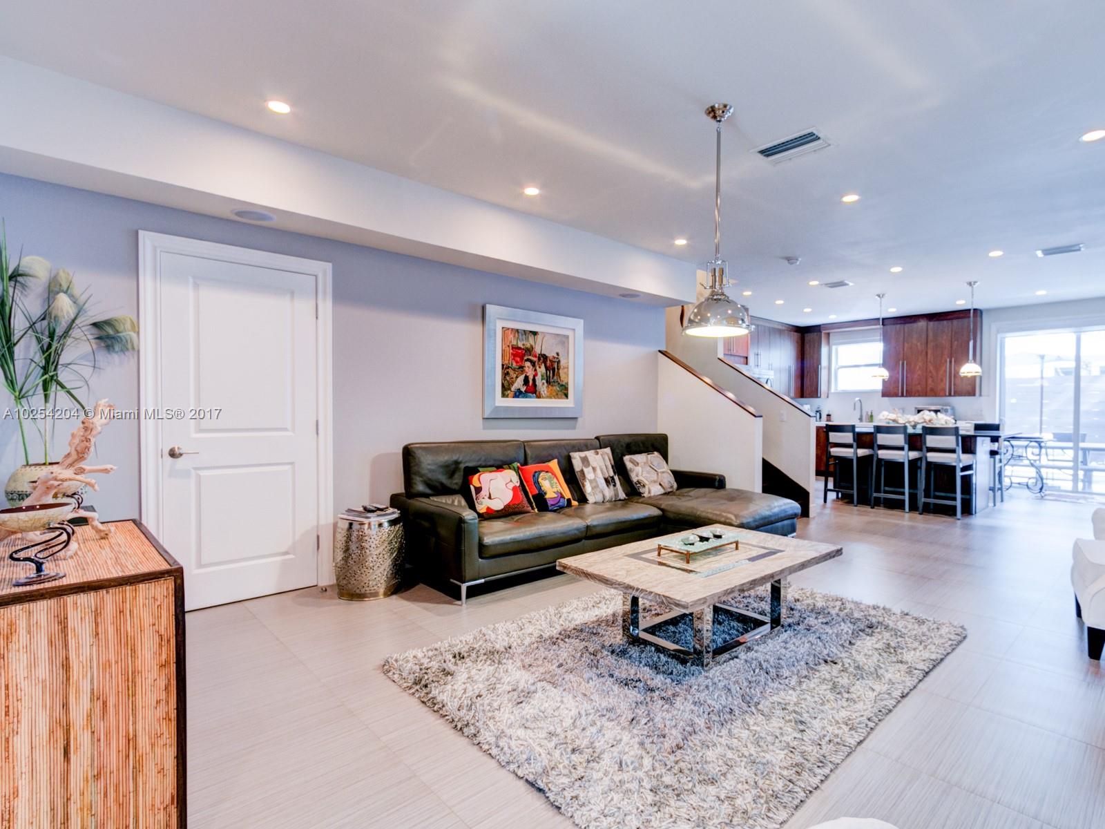 2993 Ruth Street, Unit 2993 Coconut Grove, FL 33133 - Photo 4 of 29 a living room with furniture and kitchen view