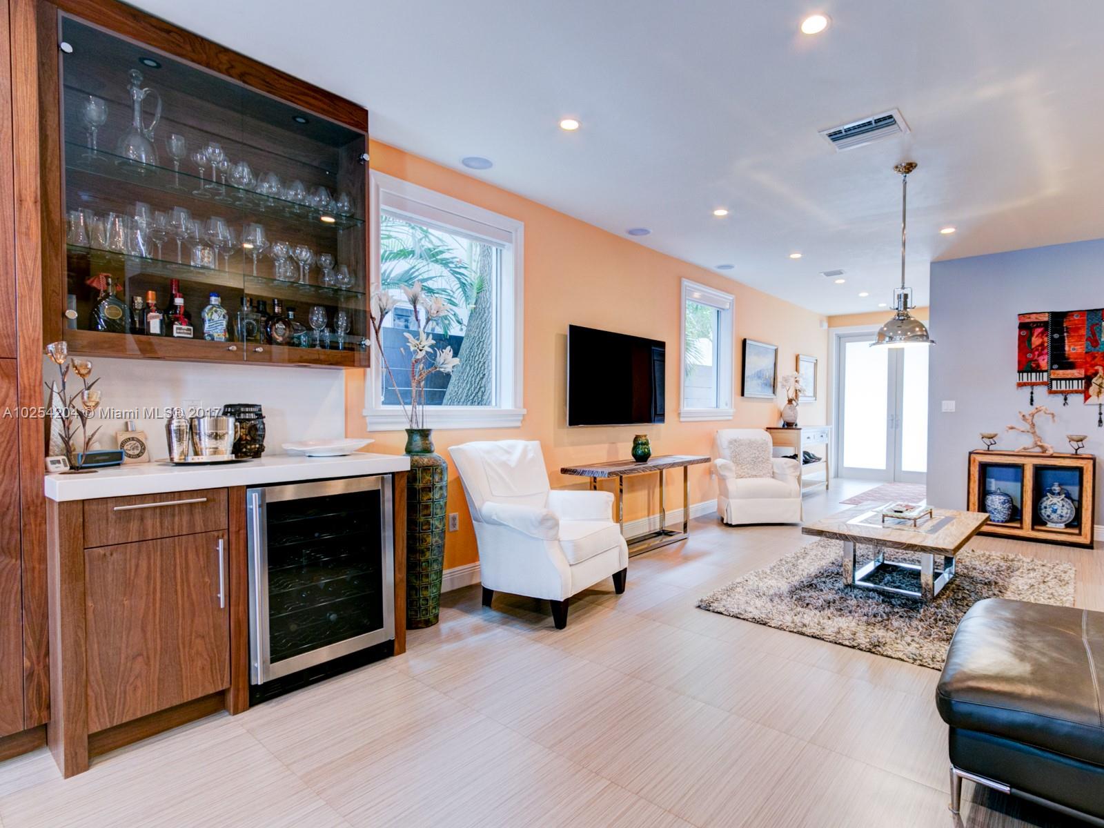 2993 Ruth Street, Unit 2993 Coconut Grove, FL 33133 - Photo 7 of 29 a living room with furniture and a flat screen tv