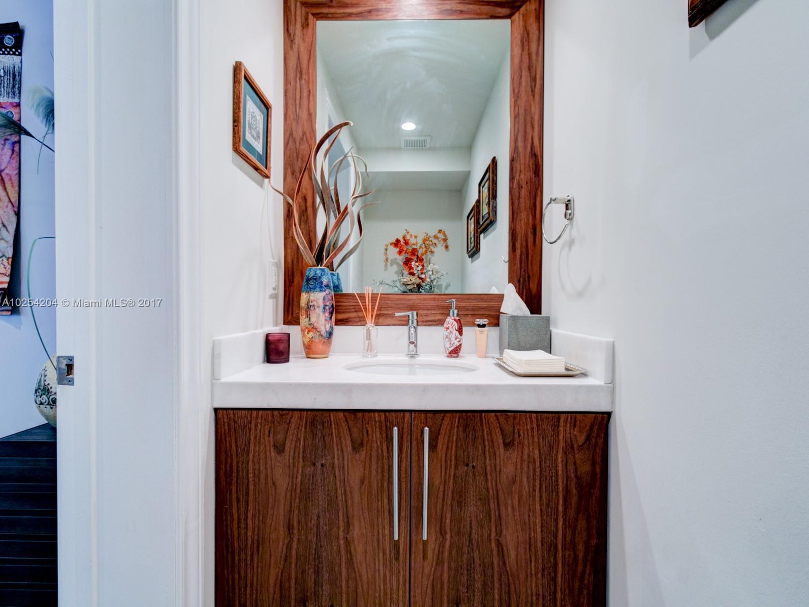2993 Ruth Street, Unit 2993 Coconut Grove, FL 33133 - Photo 10 of 29 a bathroom with a sink vanity and a mirror