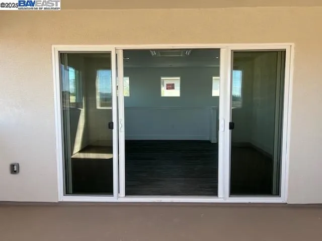 a view of an empty room and window