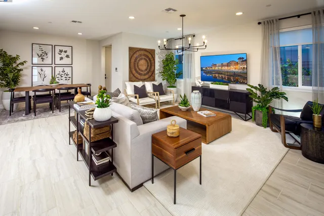 a living room with fireplace furniture and a flat screen tv