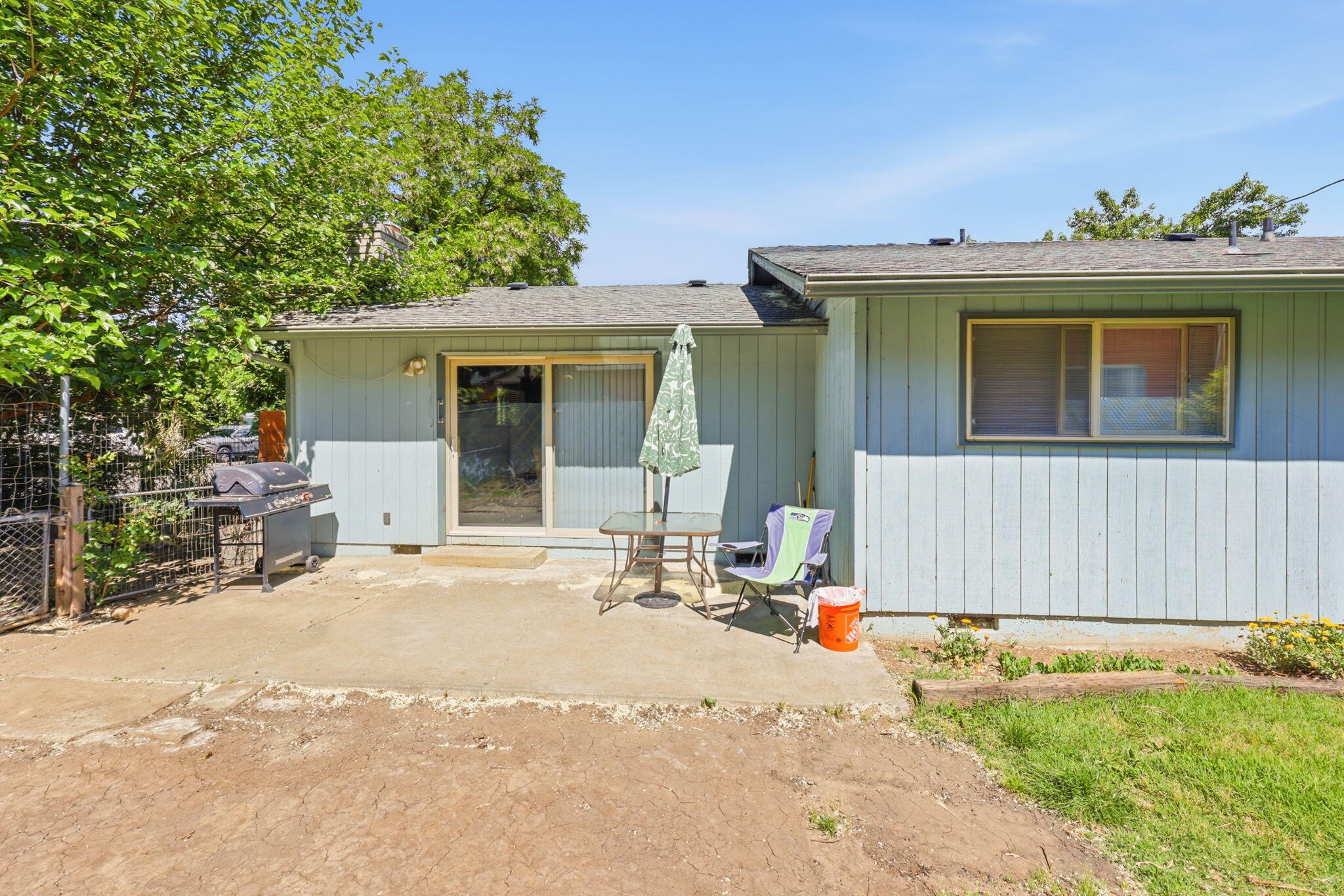 102 Elm Street Phoenix, OR 97535 - Photo 7 of 28 a view of a house with a patio