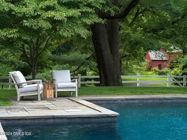 a view of a table and chairs in the garden