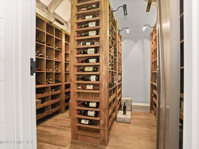 a view of room with wooden floor and windows