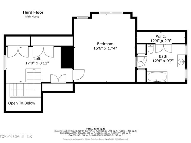 a black and white photo of a living room