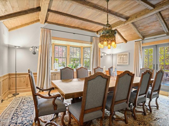 a view of a dining room with furniture window and outside view