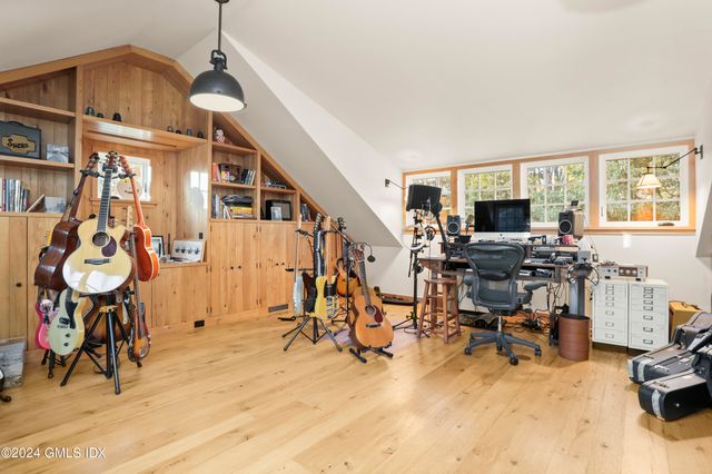 a view of a livingroom with furniture and a window