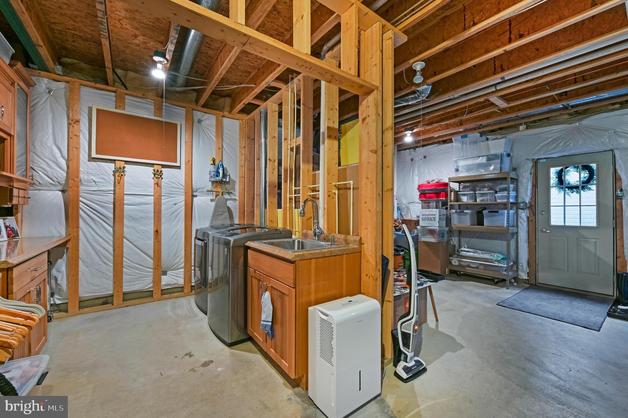 247 Ebb Point Lane Annapolis, MD 21401 - Photo 45 of 64 Lower Level, Washer/Dryer area