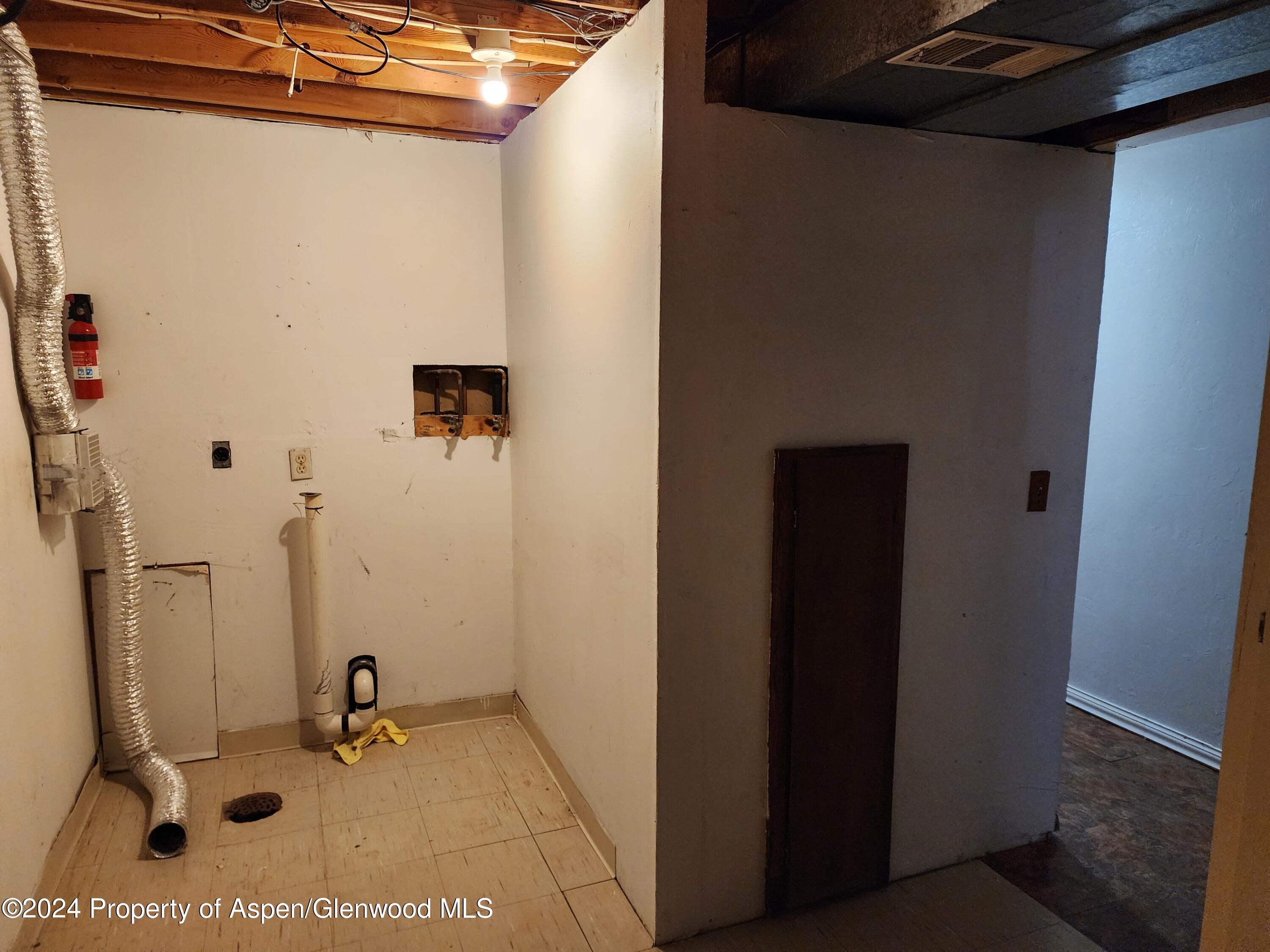 525 East 12th Street Rifle, CO 81650 - Photo 15 of 26 a bathroom with a sink and a mirror