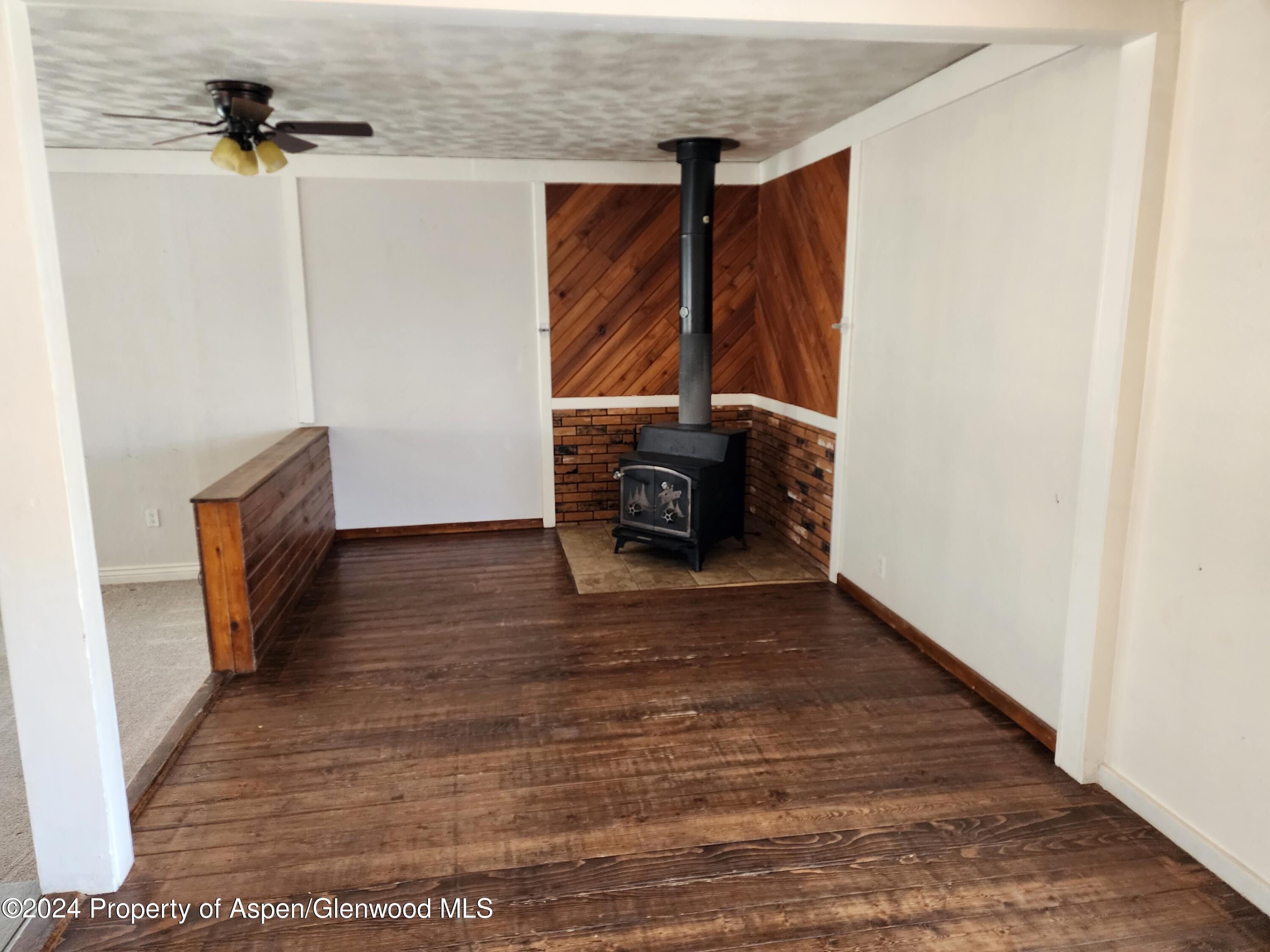 525 East 12th Street Rifle, CO 81650 - Photo 2 of 26 a view of walk in closet with clothes and shoes