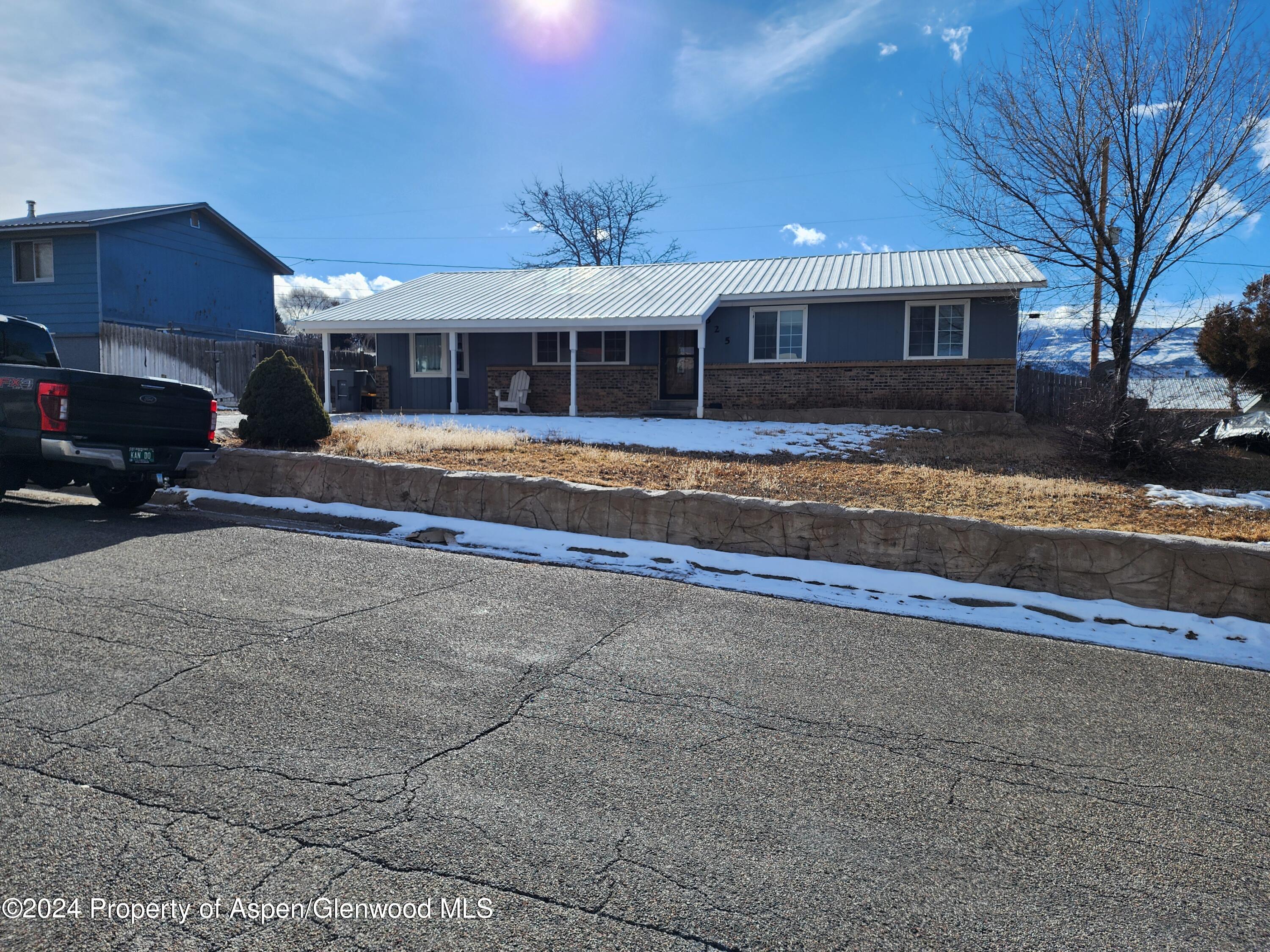 525 East 12th Street Rifle, CO 81650 - Photo 22 of 26 a view of a house with a swimming pool