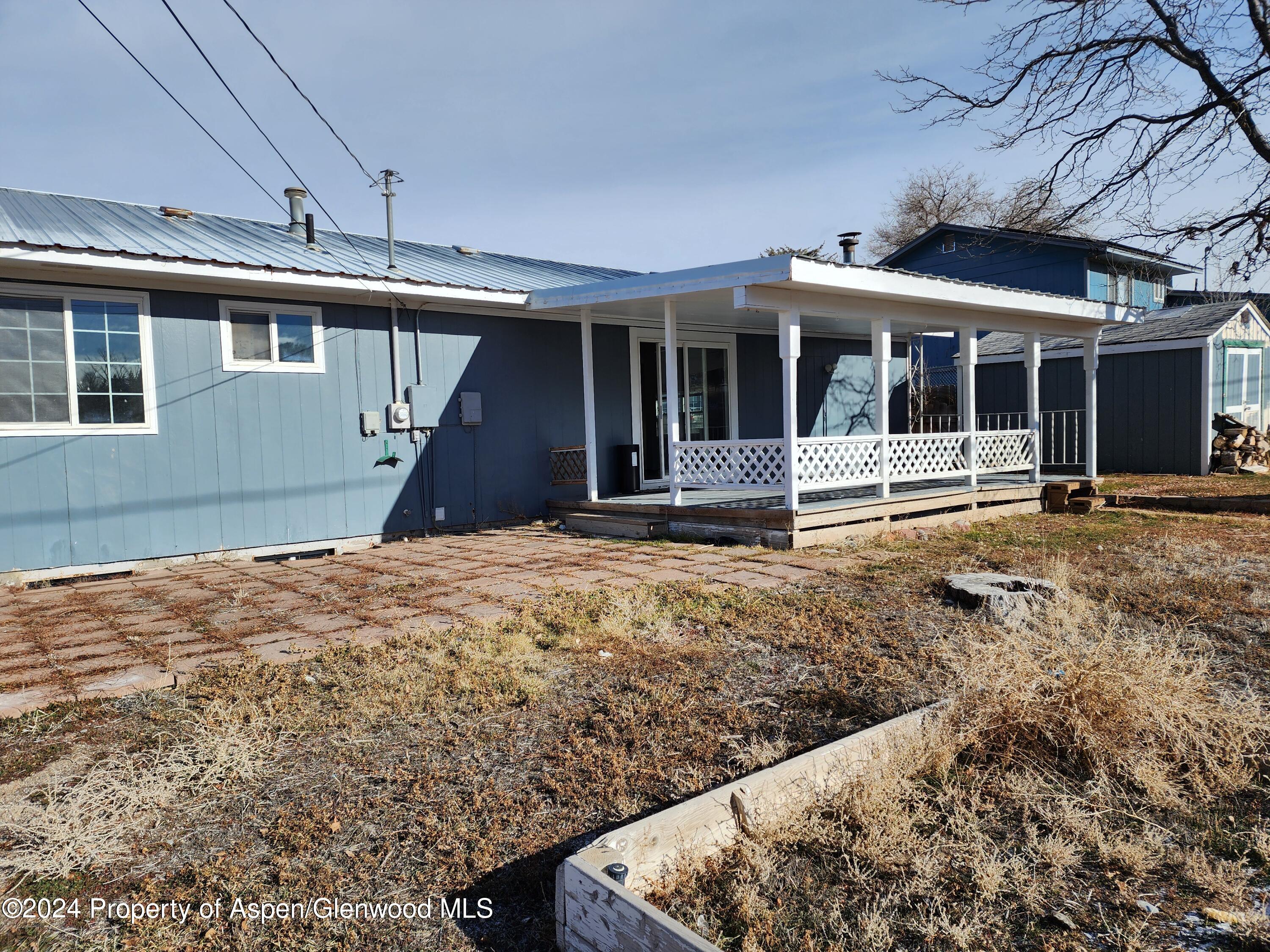 525 East 12th Street Rifle, CO 81650 - Photo 25 of 26 front view of a house with a yard