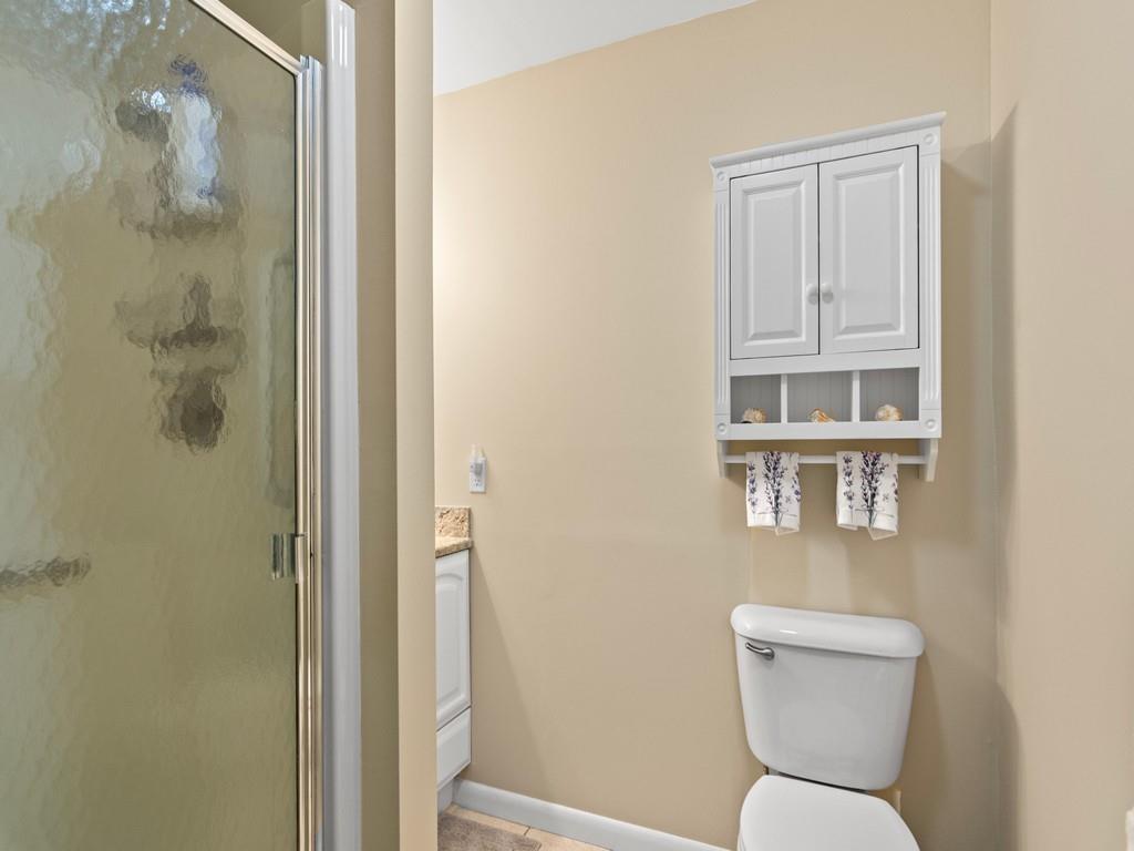5400 Highway A1a, Unit I25 Vero Beach, FL 32963 - Photo 14 of 39 a bathroom with a toilet a sink and a shower