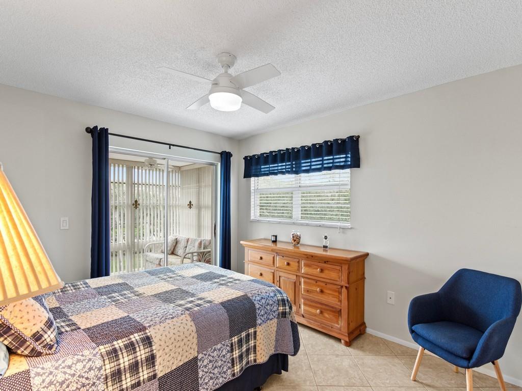 5400 Highway A1a, Unit I25 Vero Beach, FL 32963 - Photo 16 of 39 a bedroom with a bed and a chair