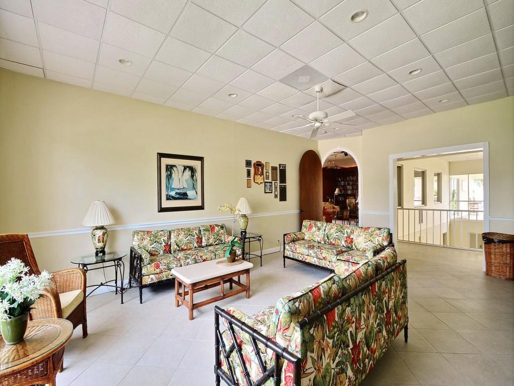 5400 Highway A1a, Unit I25 Vero Beach, FL 32963 - Photo 28 of 39 a living room with furniture fireplace and a table