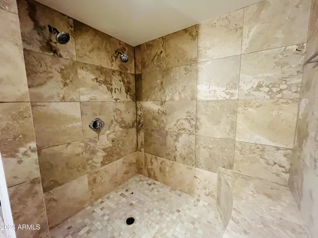 a bath tub sitting in a bathroom and sink