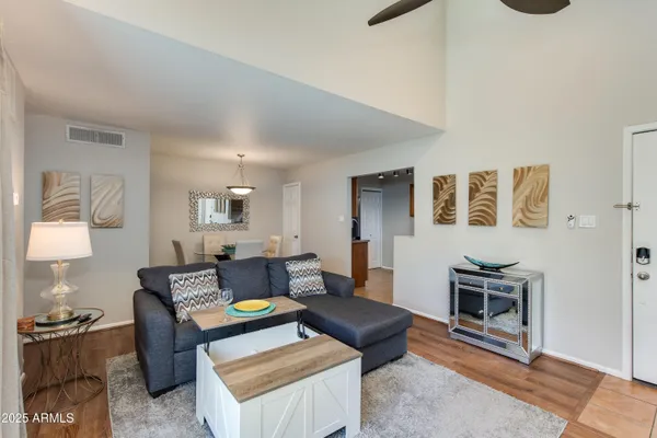 a living room with furniture and a rug