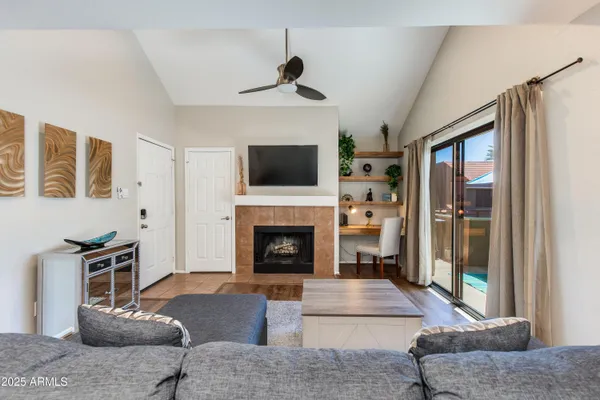 a view of cabinets and dining room with wooden floor