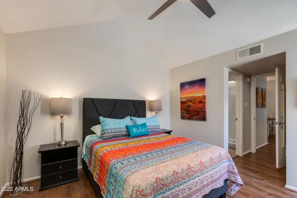 a bathroom with a sink a toilet a shower and a mirror