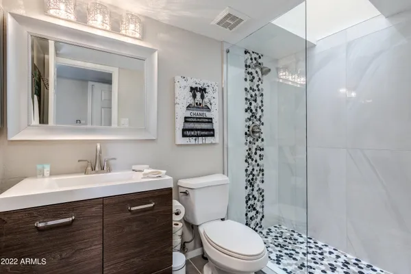 a bathroom with a bathtub and shower