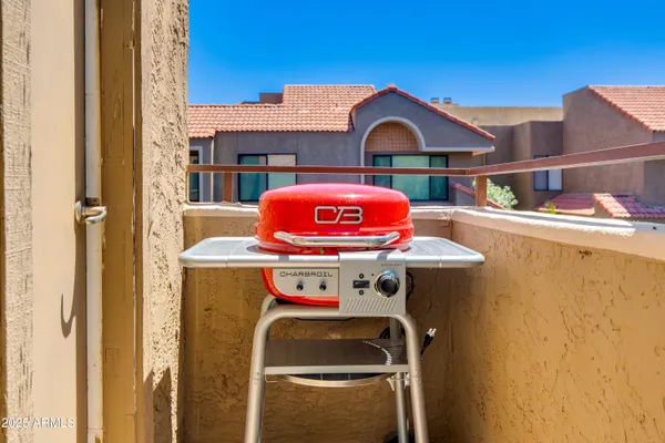 a view of a house with large windows and garage