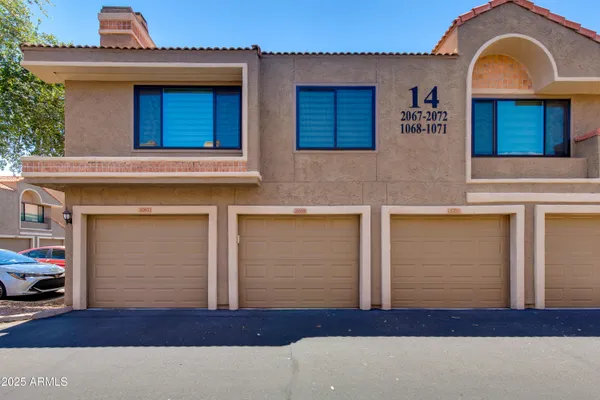 a view of a house with a street