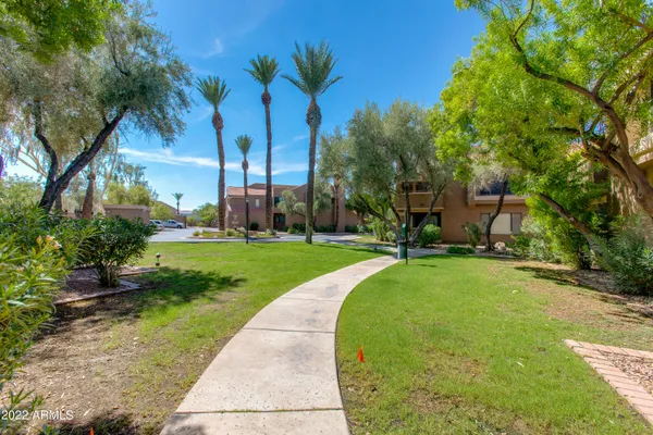 a view of swimming pool and outdoor seating