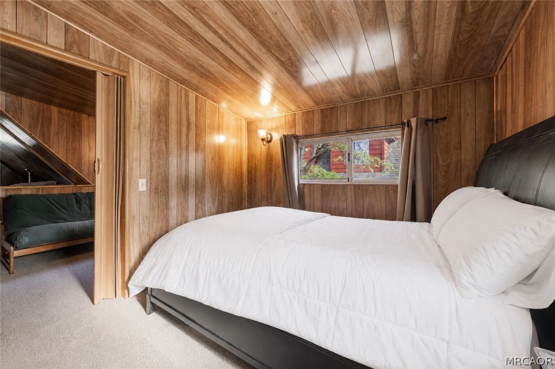 773 Sunset Lane Sugarloaf, CA 92386 - Photo 17 of 33 a bedroom with a bed and a walk in closet