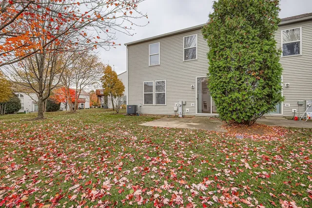 a view of a house with a tree