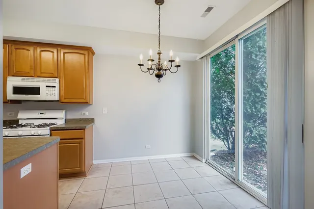 a kitchen with a stove a sink and a refrigerator