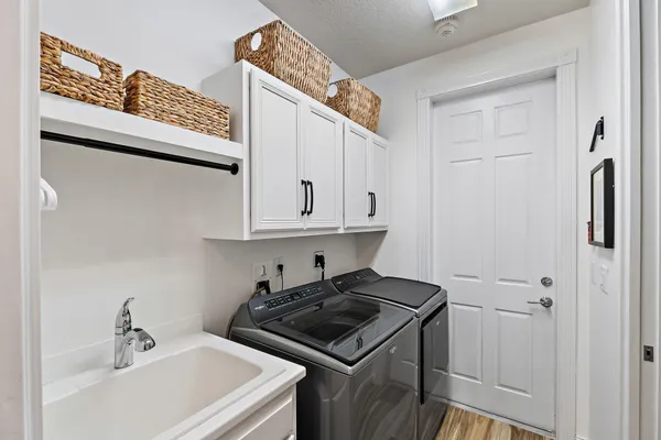 a kitchen with stainless steel appliances a sink and cabinets