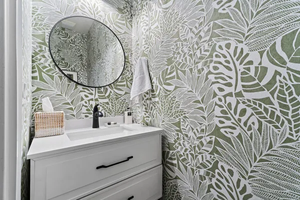 a bathroom with a sink and a mirror