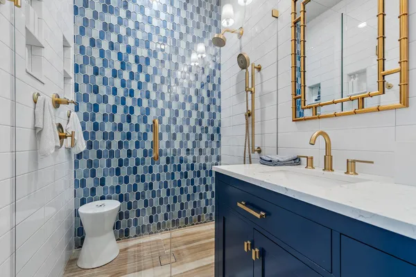 a bathroom with a sink a toilet and shower curtain