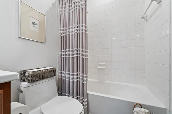 a bathroom with a toilet and a bathtub