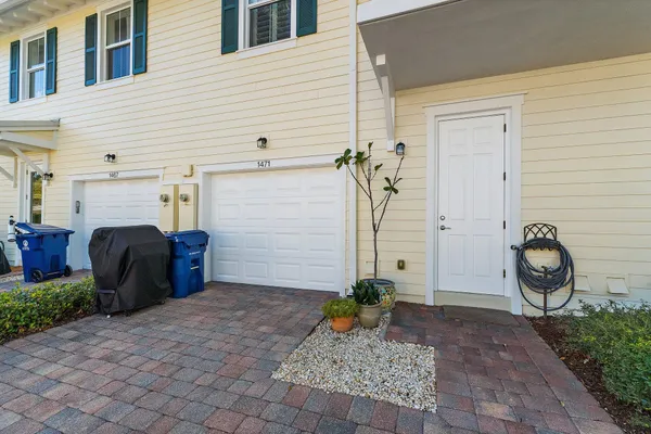 a couple of potted plants in front of a house