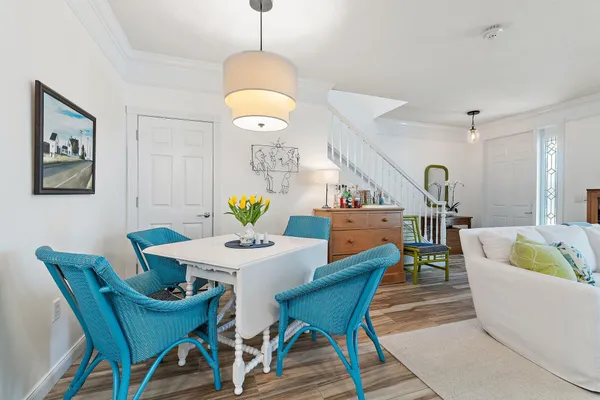 a living room with dining table and a table