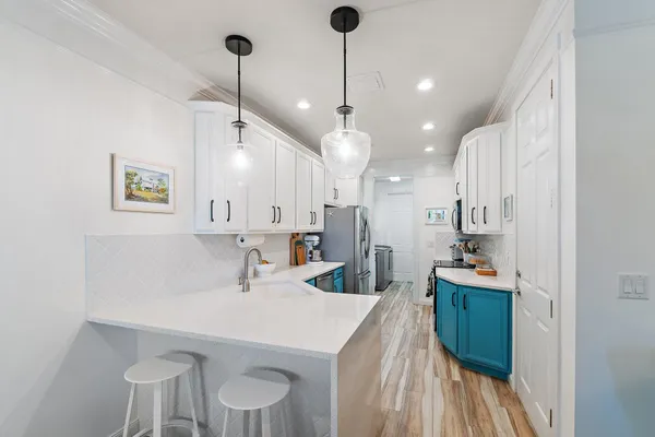 a very nice looking dining room with a table and chairs