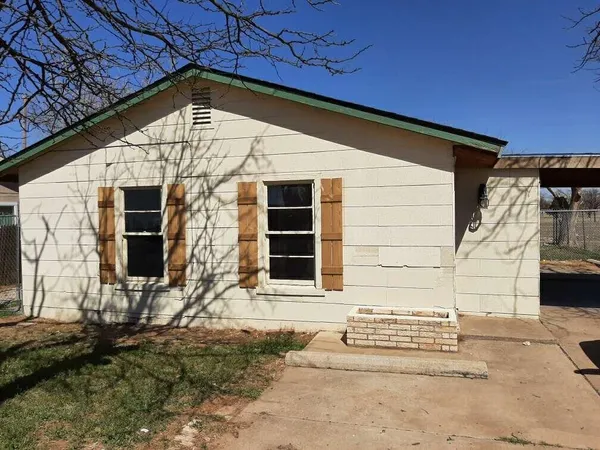 a front view of a house with a garage