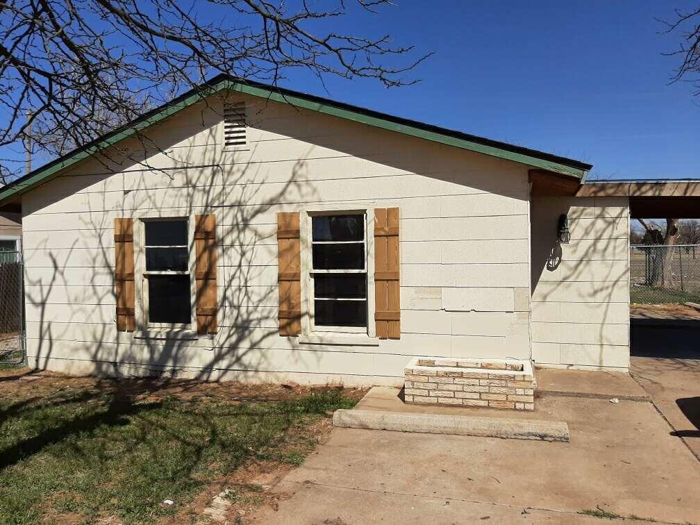 504 81st Street Lubbock, TX 79404 - Photo 2 of 3 a front view of a house with a garage