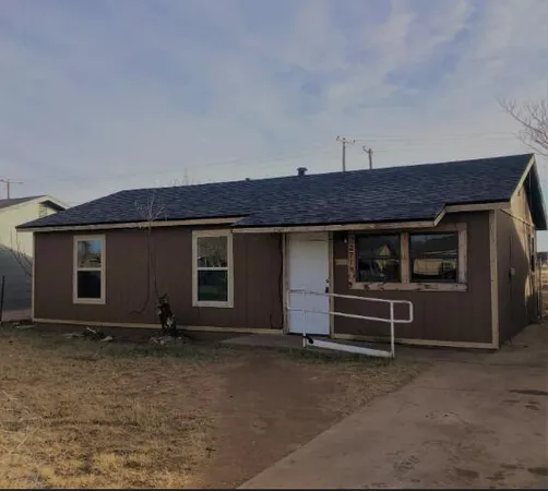 a view of a house with a flat screen tv and outdoor space