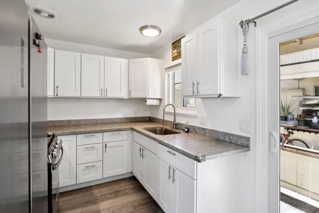 a bed room with a bed and a chair