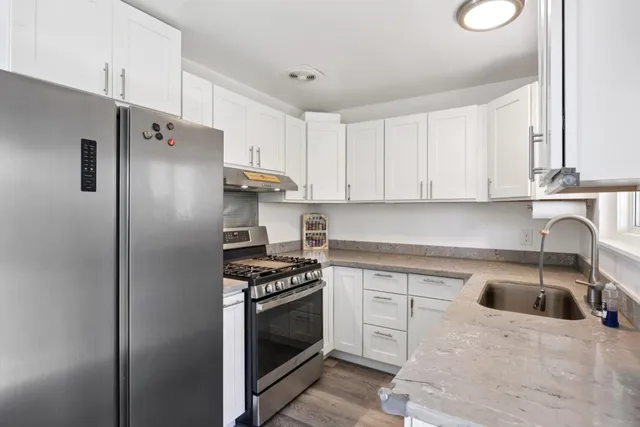 a view of a dining room with furniture window and outdoor kitchen