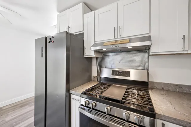 a view of a dining room with furniture and a flat screen tv