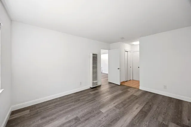 a kitchen with cabinets appliances and a counter top space
