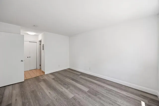 a kitchen with stainless steel appliances granite countertop a refrigerator and a stove