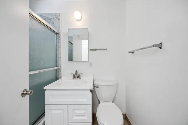 a view of a bathroom with wooden floor