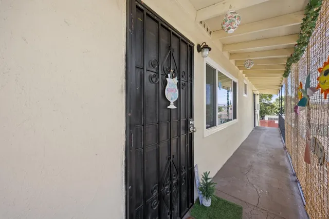a view of a workspace with furniture and rug