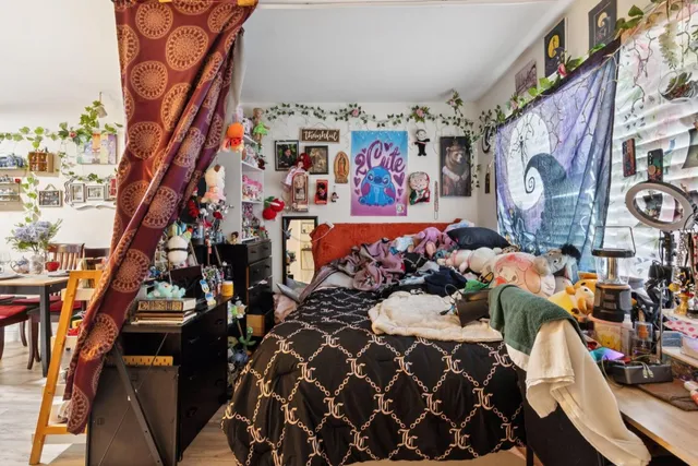 a kitchen with stainless steel appliances a stove a sink and a refrigerator