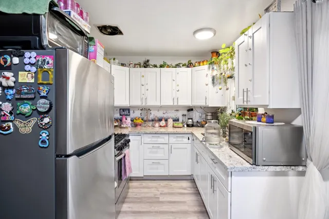a bed room with a bed and a large window